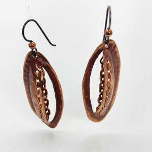 Incredibly unique copper earrings boast stitched detailing with chain.  Niobium ear wires